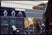 Reflection of an older building in the glass of a modern building, Montreal. Quebec, Canada (color)