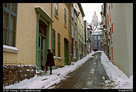 Narrow street partly covered with snow, Quebec City. Quebec, Canada