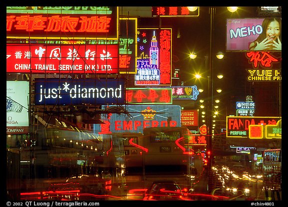 Nathan road, brilliantly lit by neon lights at night, Kowloon. Hong-Kong, China (color)