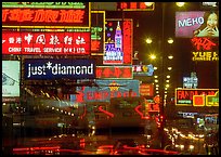 Nathan road, brilliantly lit by neon lights at night, Kowloon. Hong-Kong, China