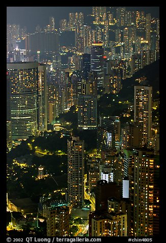 Residential towers on steep hillside from Victoria Peak by night. Hong-Kong, China