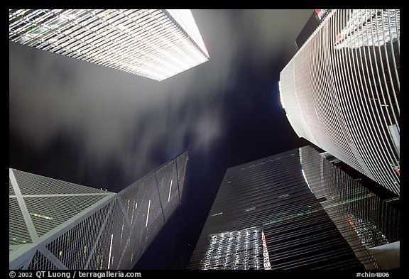 Looking up from plaza with Bank of China and Cheung Kong Center buildings by night. Hong-Kong, China