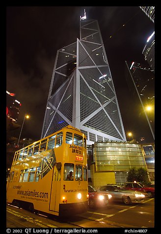 Old tram and Bank of China building (369m), designed by Pei, by night. Hong-Kong, China (color)