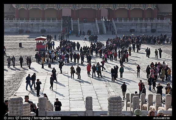 Crowd of tourists in the Sea of Flagstone (court of the imperial palace), Forbidden City. Beijing, China (color)