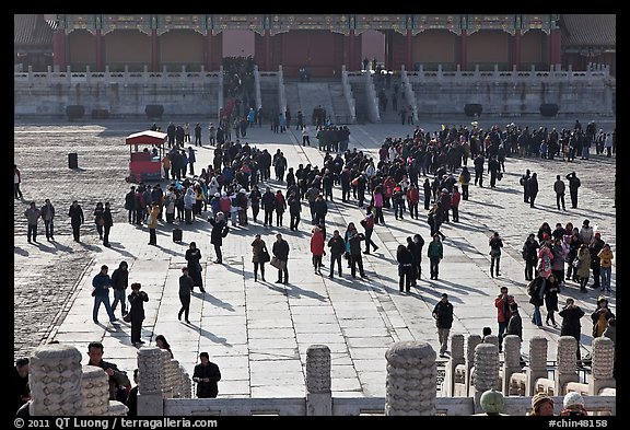 Crowd of tourists in the Sea of Flagstone (court of the imperial palace), Forbidden City. Beijing, China