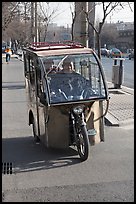 Enclosed three wheel motorcycle on street. Beijing, China ( color)