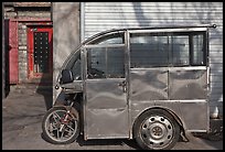 Enclosed scooter on sidewalk. Beijing, China ( color)