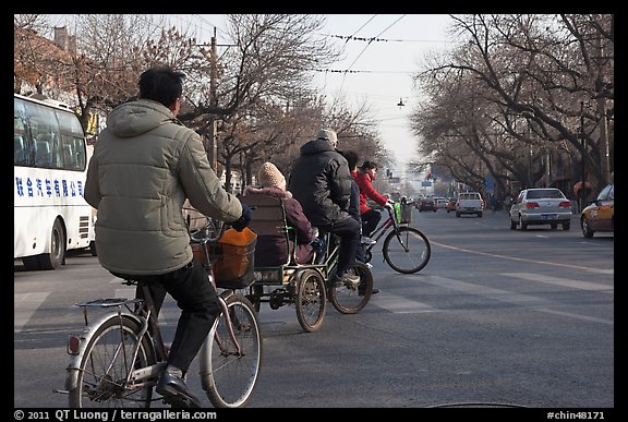 Bicyles and cyclo on street. Beijing, China (color)