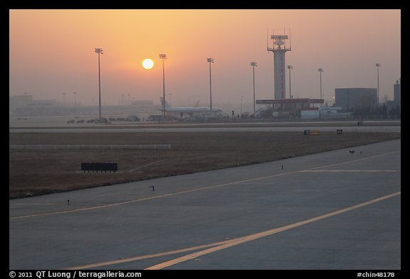 Tarmac and control tower at sunset, Beijing Capital International Airport. Beijing, China