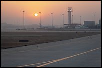 Tarmac and control tower at sunset, Beijing Capital International Airport. Beijing, China