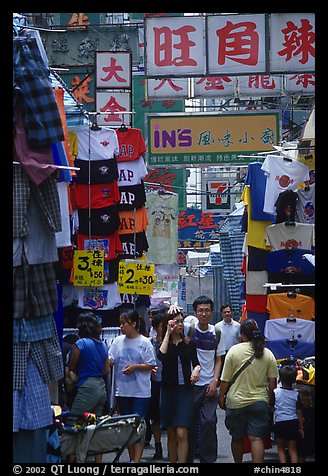 Crowded alley with clothing vendors, Kowloon. Hong-Kong, China