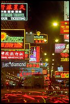 Nathan road, brilliantly lit by neon lights at night, Kowloon. Hong-Kong, China (color)