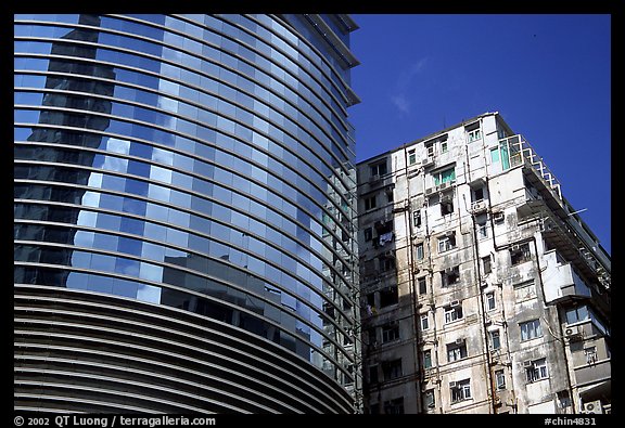 Glass building aside an old building, Kowloon. Hong-Kong, China