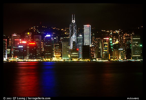 Hong-Kong Island skyline across the harbor by night. Hong-Kong, China (color)