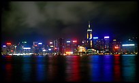 Colorful reflections of Hong-Kong Island lights across the harbor by night. Hong-Kong, China (color)