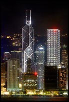 Bank of China (369m) and Cheung Kong Center (290m) buildings  across  harbor by night. Hong-Kong, China (color)