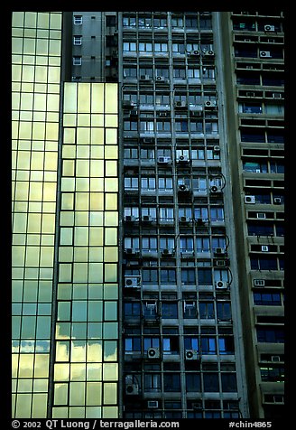 Modern building next to old  building with air conditioners, Hong-Kong Island. Hong-Kong, China (color)