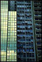 Modern building next to old  building with air conditioners, Hong-Kong Island. Hong-Kong, China