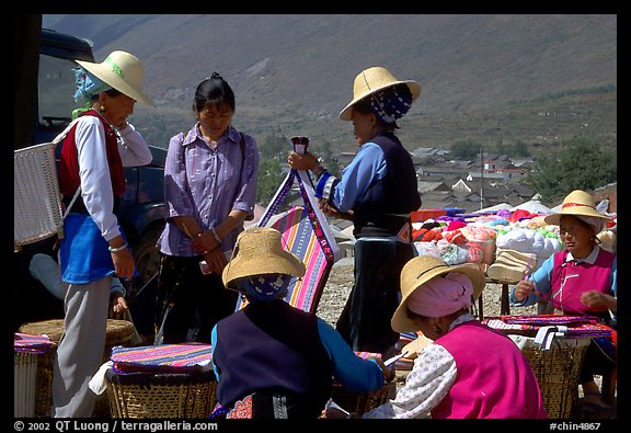 Bai women wearing tribespeople dress at the Monday market. Shaping, Yunnan, China (color)