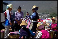Bai women wearing tribespeople dress at the Monday market. Shaping, Yunnan, China