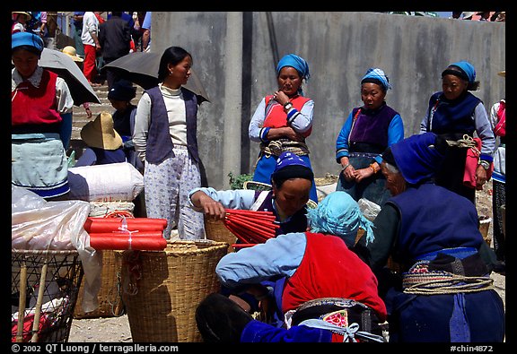 Women of the Bai tribe selling incense. Shaping, Yunnan, China