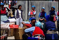 Women of the Bai tribe selling incense. Shaping, Yunnan, China (color)