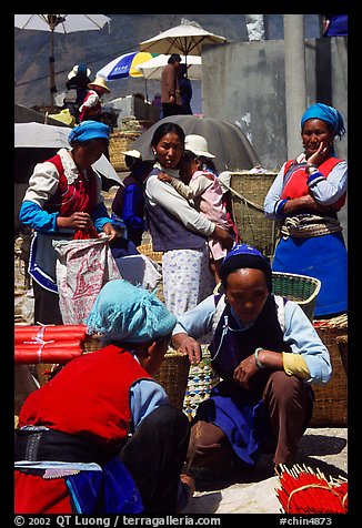 Bai tribeswomen selling incense. Shaping, Yunnan, China