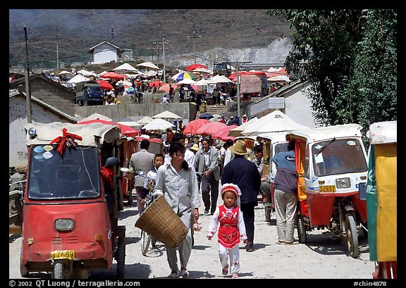 Tuk-tuk waiting for villagers ouside the Monday market. Shaping, Yunnan, China (color)