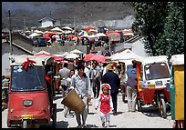 Tuk-tuk waiting for villagers ouside the Monday market. Shaping, Yunnan, China ( color)