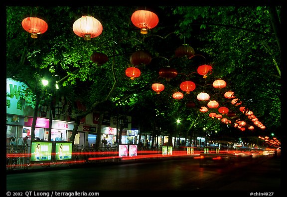 Zhengyi Lu illuminated by lanterns at night. Kunming, Yunnan, China