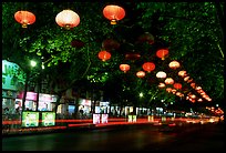 Zhengyi Lu illuminated by lanterns at night. Kunming, Yunnan, China