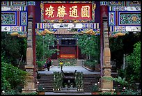 Woman and girl on entrance alley of Yantong Si. Kunming, Yunnan, China