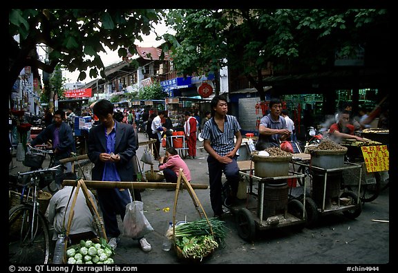 Street food vendors in an old alley. Kunming, Yunnan, China