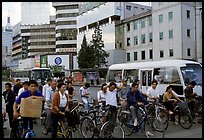 Bicyclists waiting for traffic light. Kunming, Yunnan, China