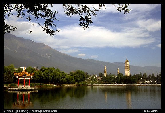 San Ta Si (Three pagodas) reflected in a lake, early morning. Dali, Yunnan, China (color)