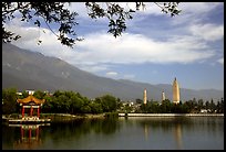 San Ta Si (Three pagodas) reflected in a lake, early morning. Dali, Yunnan, China