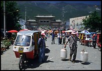 Street activity in front of the West gate. Dali, Yunnan, China