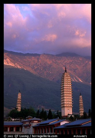 San Ta Si (Three pagodas) at sunrise with Cang Shan mountains in the background. Dali, Yunnan, China (color)