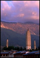 San Ta Si (Three pagodas) at sunrise with Cang Shan mountains in the background. Dali, Yunnan, China