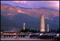 San Ta Si (Three pagodas) at sunrise with Cang Shan mountains in the background. Dali, Yunnan, China