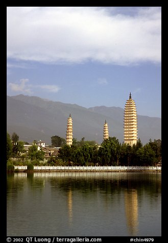 San Ta Si (Three pagodas) reflected in a lake, early morning. Dali, Yunnan, China (color)