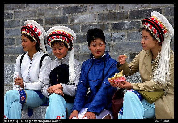 Women wearing traditional Bai dress. Dali, Yunnan, China