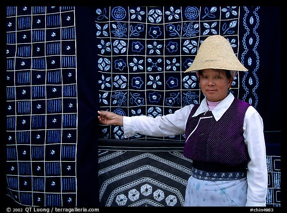 Woman in Bai dress showing drapes of traditional design. Dali, Yunnan, China