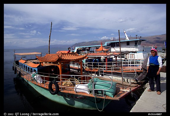 Boats on a pier of Erhai Lake. Dali, Yunnan, China (color)