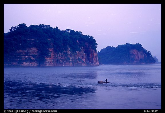 Cliffs of Lingyun Hill and Wuyou Hill at dusk, whose shape evokes a lying buddha. Leshan, Sichuan, China