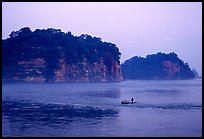 Cliffs of Lingyun Hill and Wuyou Hill at dusk, whose shape evokes a lying buddha. Leshan, Sichuan, China (color)