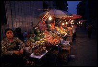 Fruit vendor, night market. Leshan, Sichuan, China ( color)