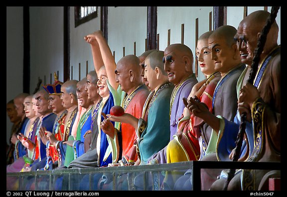 Incredible arrays of postures and expressions of some of the 1000 Terracotta arhat monks in Luohan Hall. Leshan, Sichuan, China (color)