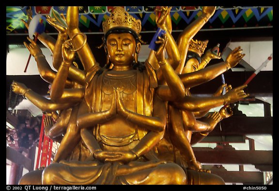 Statue of Avalokiteshvara, the Bodhisattva of Mercy inside Luohan Hall. Leshan, Sichuan, China (color)