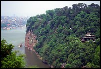 Cliffs of Lingyun Hill with the city in the background. Leshan, Sichuan, China